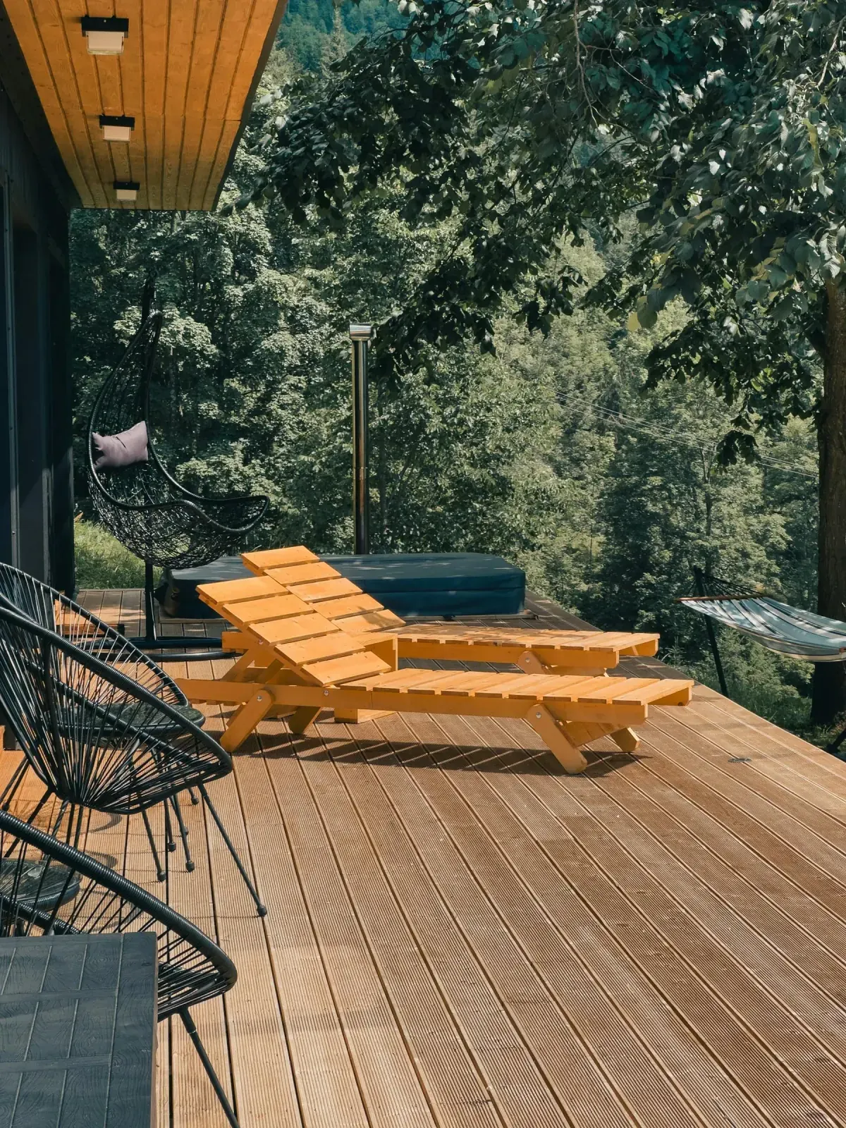 Richly stained deck surrounded by greenery.