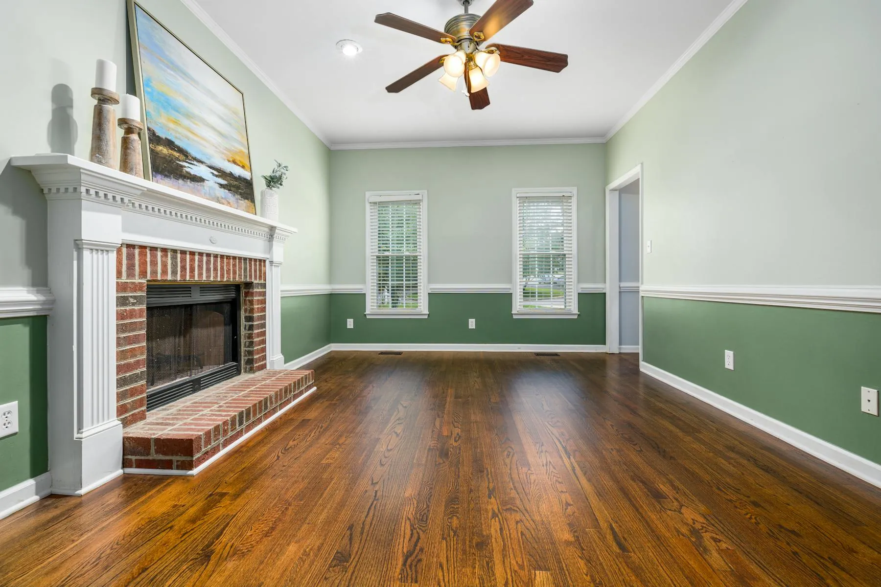 Elegant living room with crisp walls, fireplace focal point, and polished trim work.