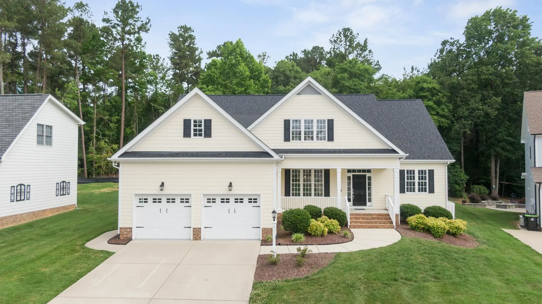 Refined suburban home exterior with clean siding lines, fresh paint, and strong curb appeal.